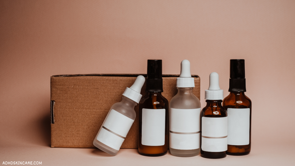 An image showing 5 serum bottles which are the third step in a 4-step skincare routine for oily skin