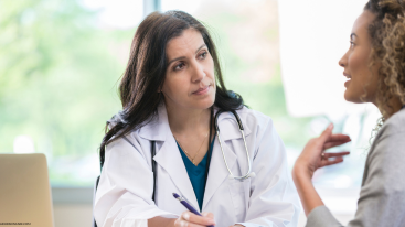 A doctor listening to patient talking about how Ritalin affects skin